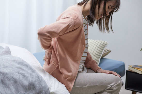 Woman with joint pain finding relief with mobility support